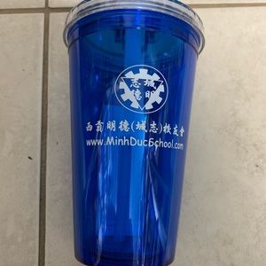 Water cup with straw .